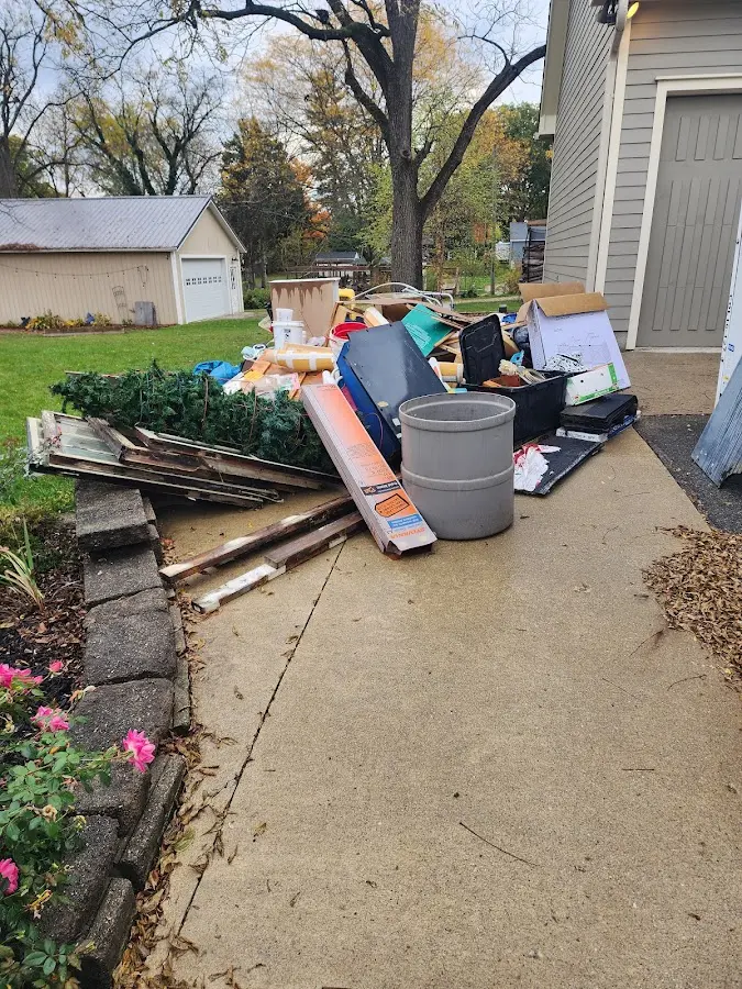 Dumpster being loaded with debris for 30 Yard Dumpster Rental in James City